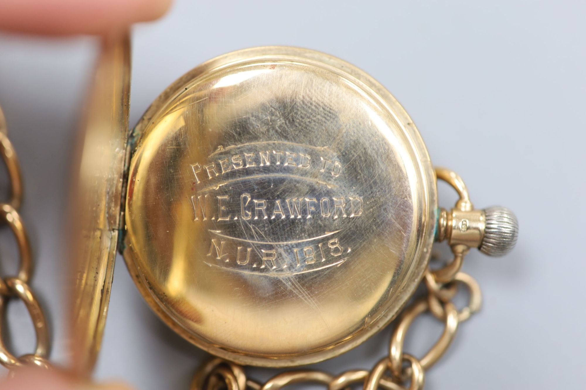 A George V 9ct gold Waltham half hunter pocket watch, with a 9ct gold albert.